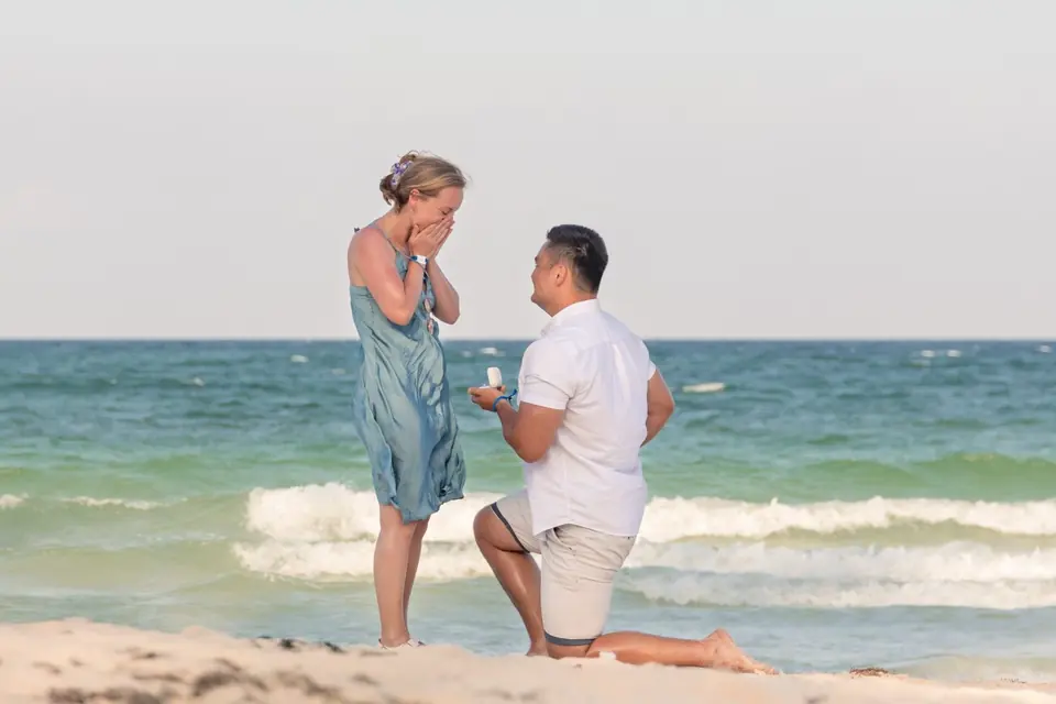 Joe proposing to Sophie on the beach