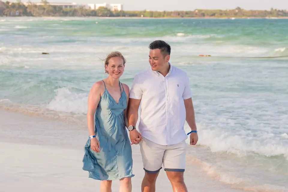Sophie and Joe walking along the beach